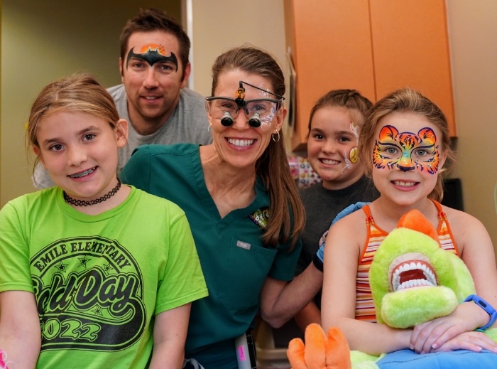 Three children smiling with Bastrop Texas pediatric dentists