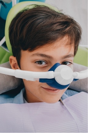 Child receiving nitrous oxide sedation dentistry treatment