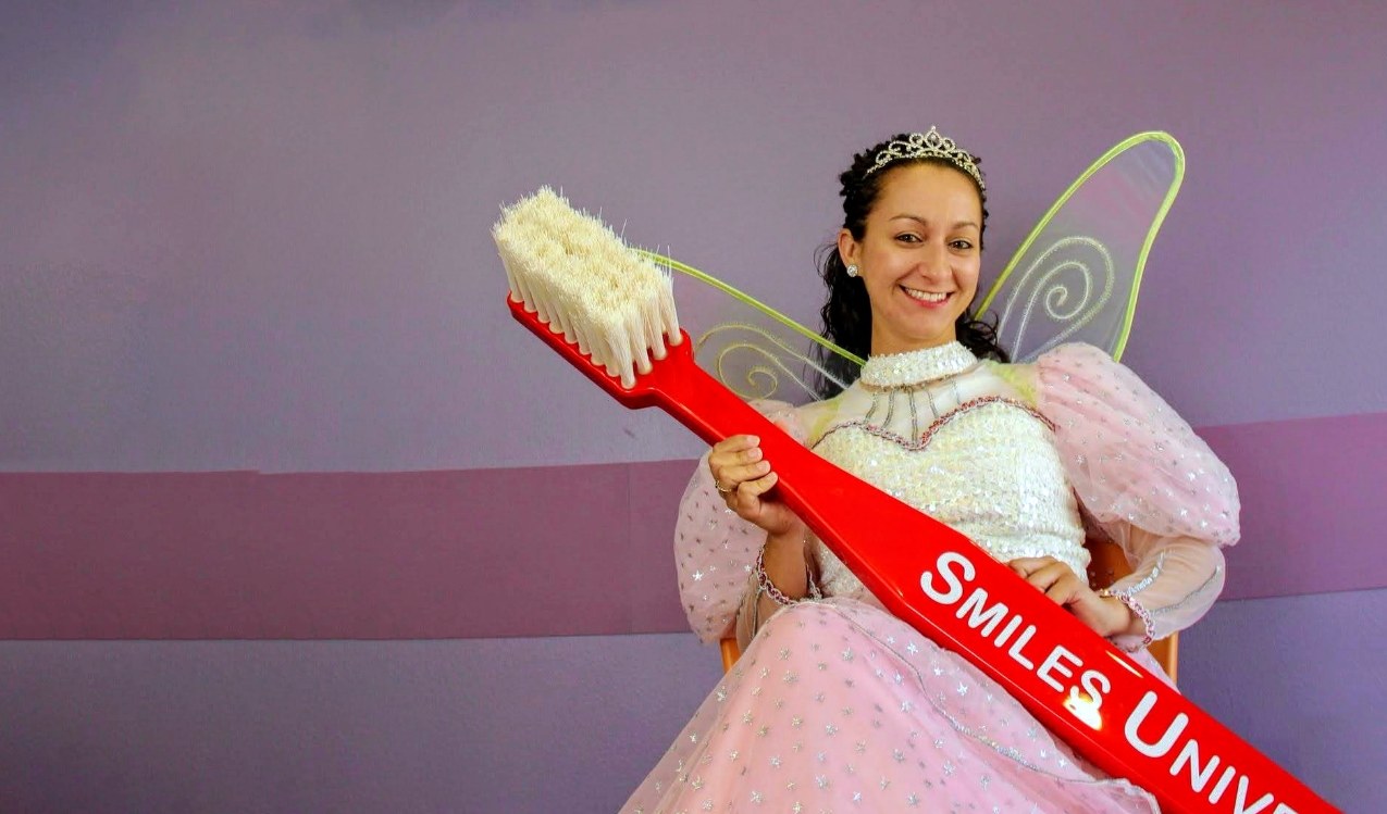 Dental team member dressed as tooth fairy