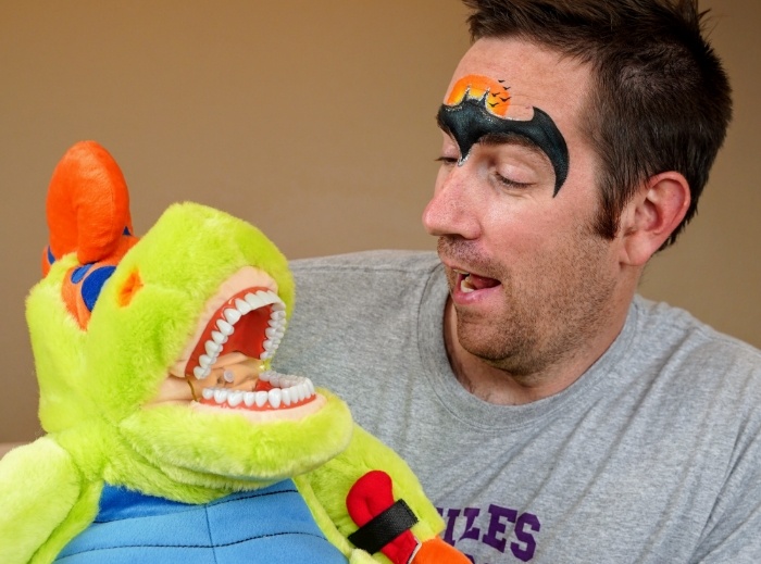 Doctor Adam using dental hygiene puppet