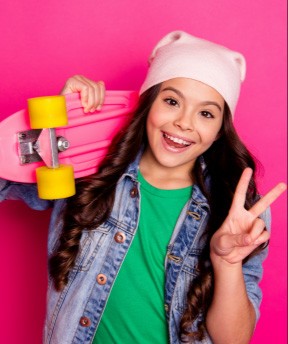 Young dental patient smiling after minimal invasive dentistry