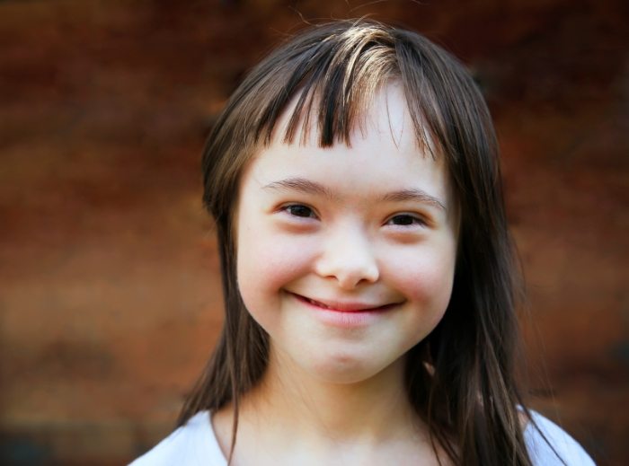 Child smiling after special needs dentistry visit