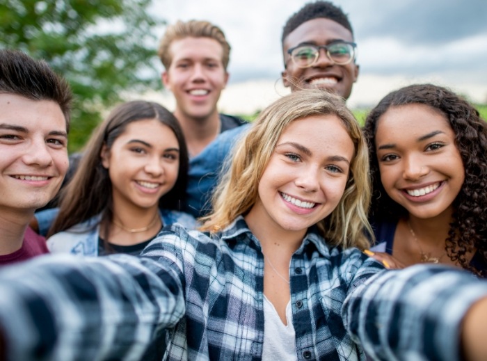 Teens smiling after teeth whitening treatment