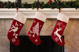 Close-up of stockings hung above the fireplace