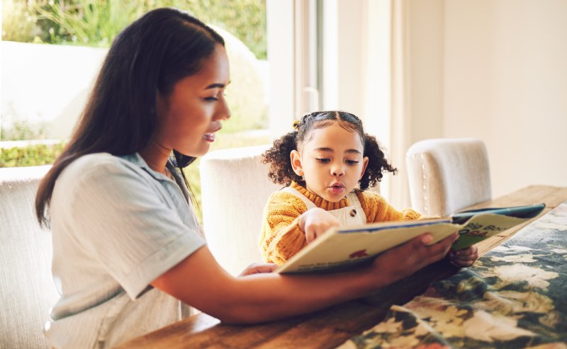 mother and child reading a book